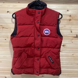New without tags Canada Goose down vest. Red in colour, size small.